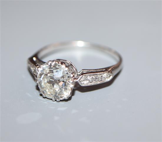 A mid 20th century white metal and single stone diamond ring, with diamond set shoulders, size K/L.